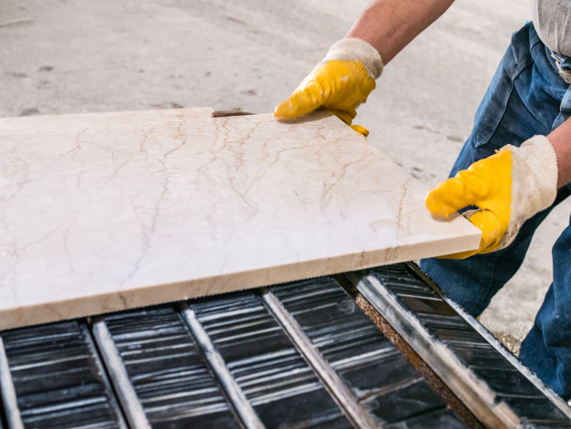 Worker is holding marble  in marble factory